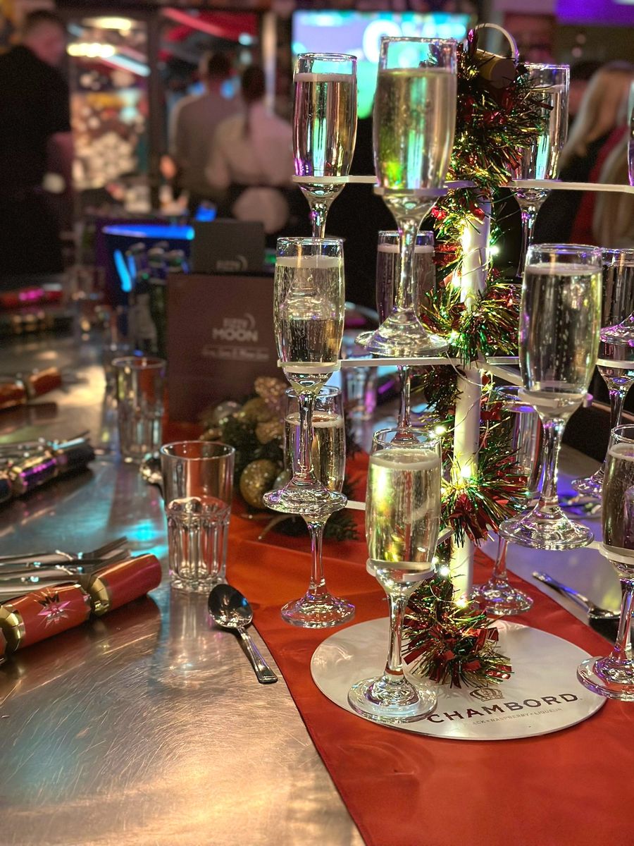Prosecco tower dressed with tinsel and fairy lights