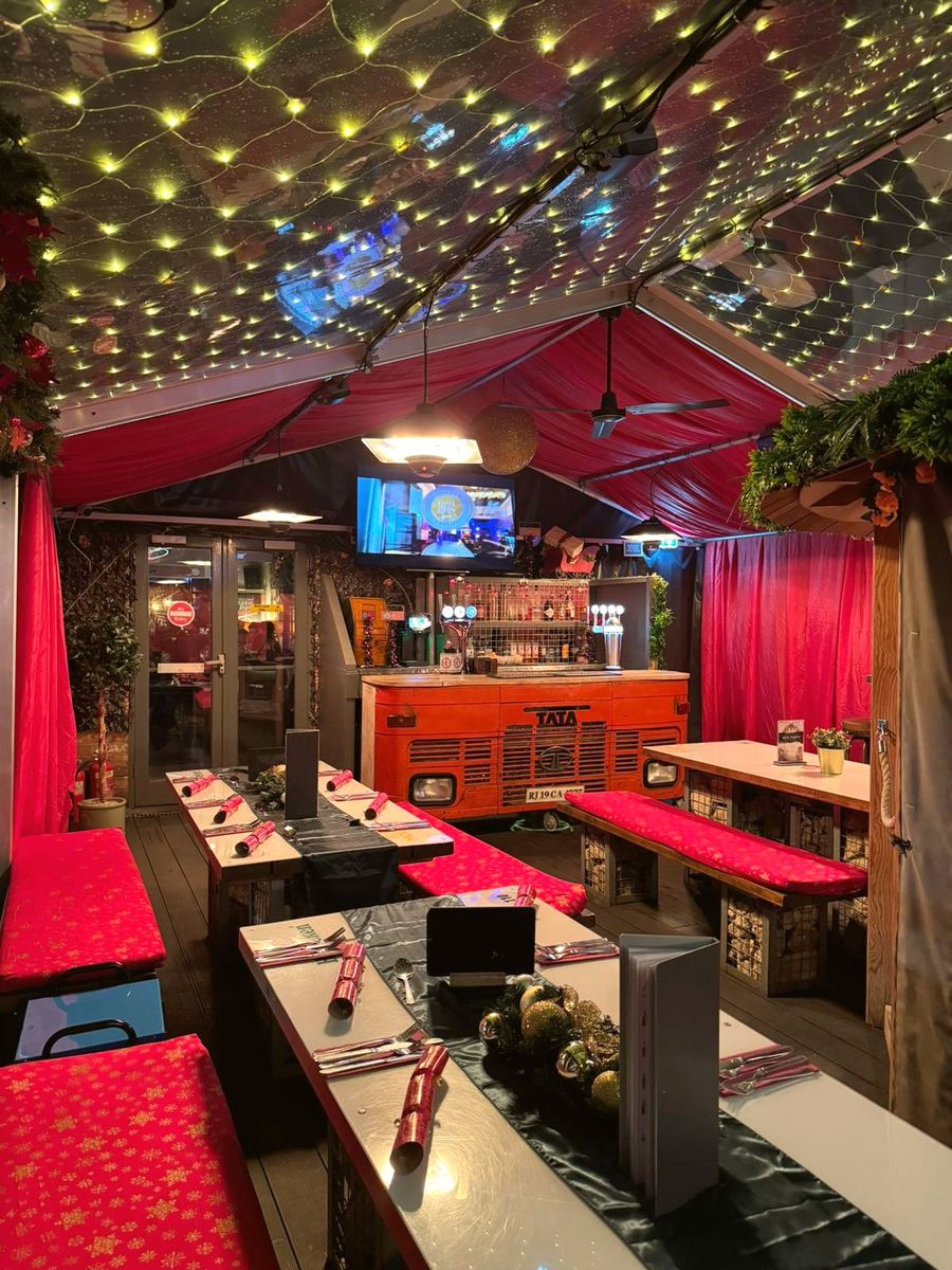 Marquee dressed for Christmas with fairy lights and private bar